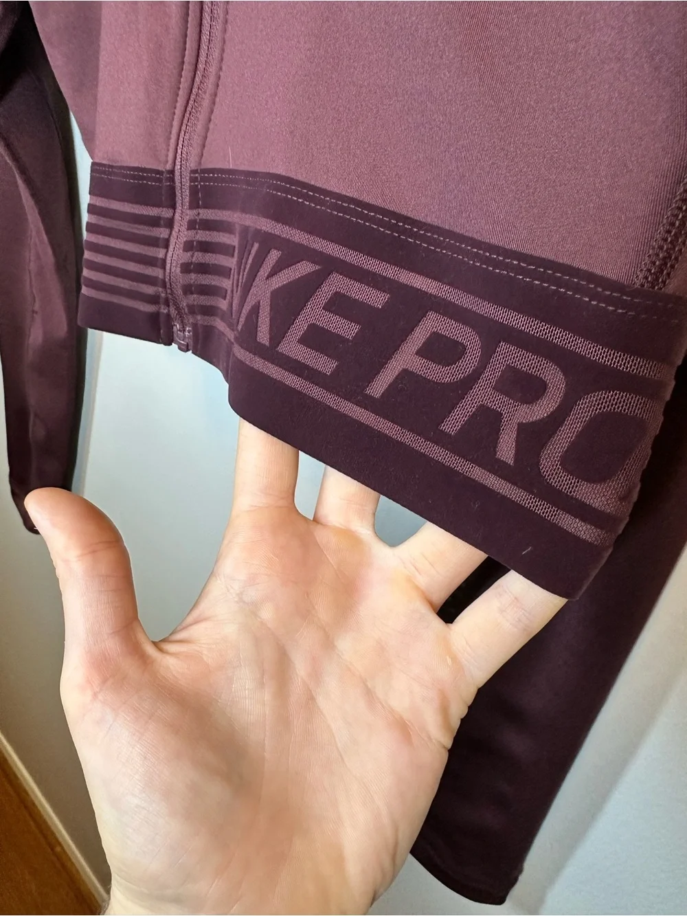 Nike Dri-FIT Cropped Zip Jacket in Burgundy